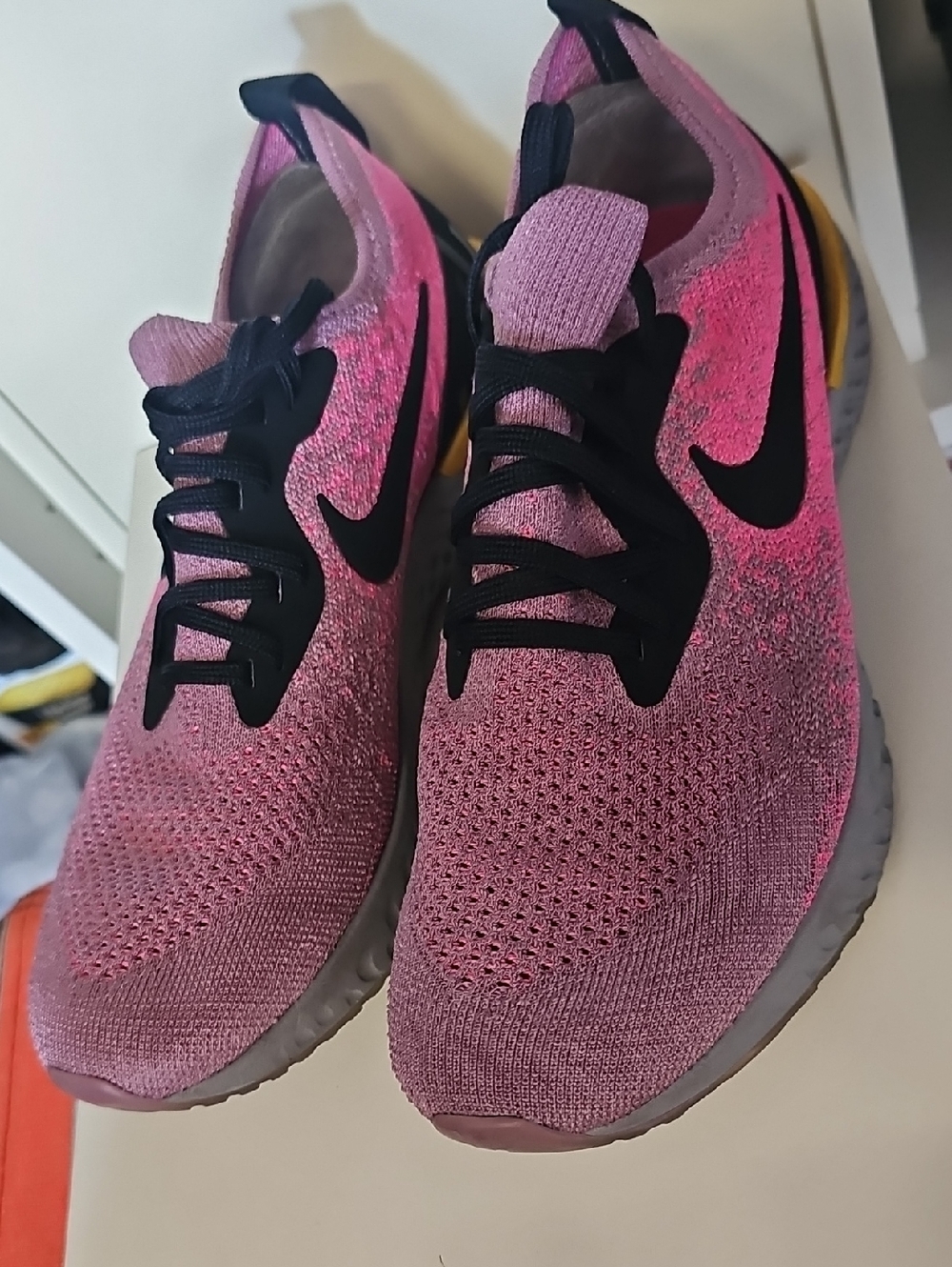 Nike Women’s Pink and Black Flyknit Running Sneakers